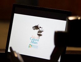 Computer monitor with the orange county arts and culture logo